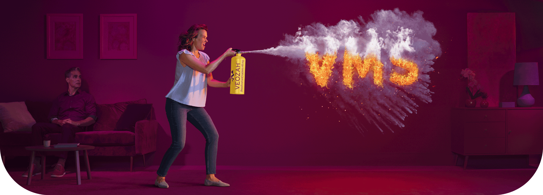 Woman spraying VEOZAH™ (fezolinetant) logo fire extinguisher at VMS fire in living room with man sitting and watching